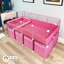 Load image into Gallery viewer, Pink 2x4 Ozzy Cages C&C Guinea Pig Enclosure with clear sides, pink grids, a stand and storage boxes. Also features an Ozzy Kitchenette litter tray.