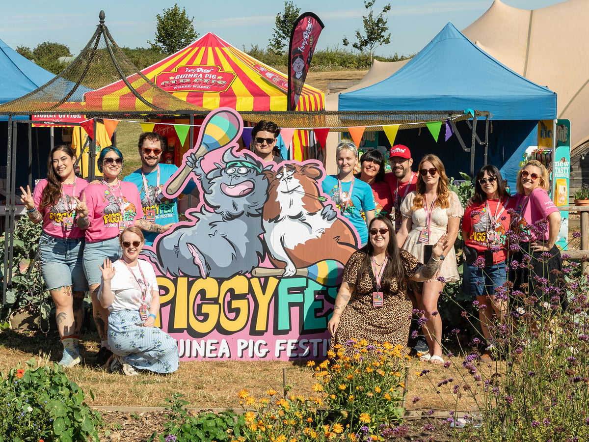 The Piggy Fest 2026 volunteers and helpers in front of the Piggy Fest sign at Jimmy's Farm & Wildlife Park