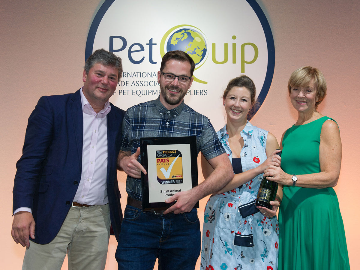 Rik and Helen Cridland holding the PATS Telford 2017 New Product Showcase winner's award for small animal products